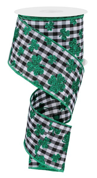 a black and white checkered ribbon with shamrocks on it