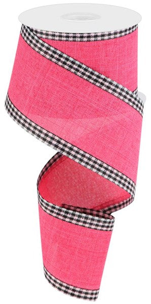 a pink ribbon with black and white checks on it