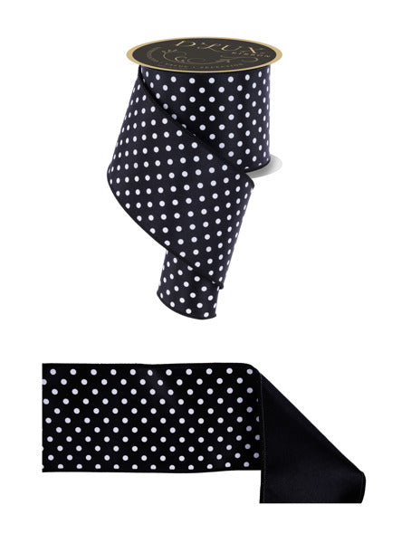 a black and white polka dot ribbon with a gold label.
