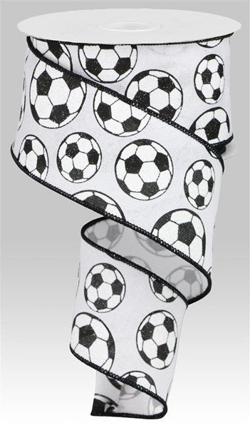 a roll of toilet paper with soccer balls on it