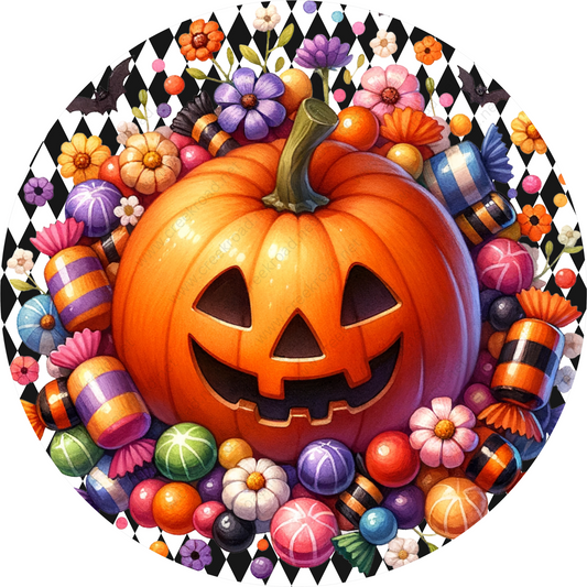 a pumpkin surrounded by candy and flowers