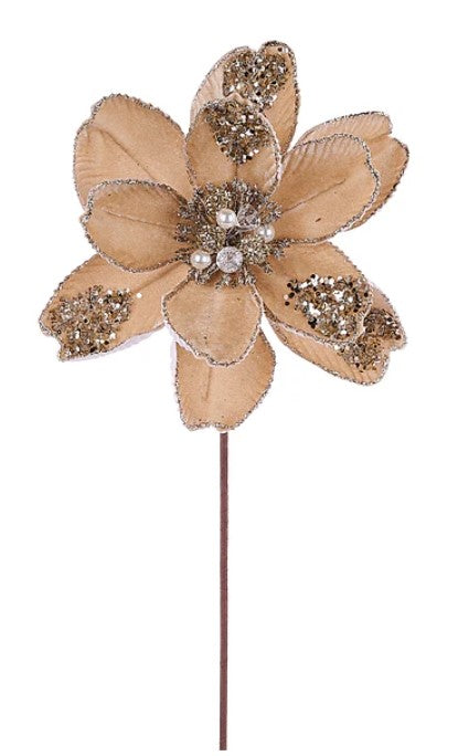 A decorative flower with a gold and beige color scheme, adorned with small jewels or glitter.