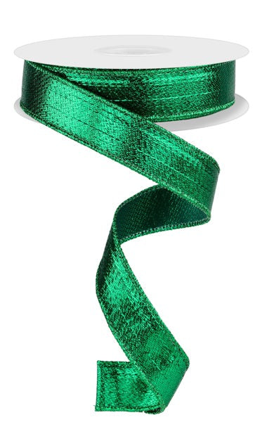 a roll of green satin ribbon on a white background