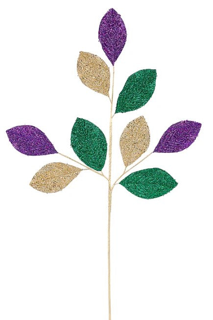 A branch with purple and green glitter leaves attached to it.