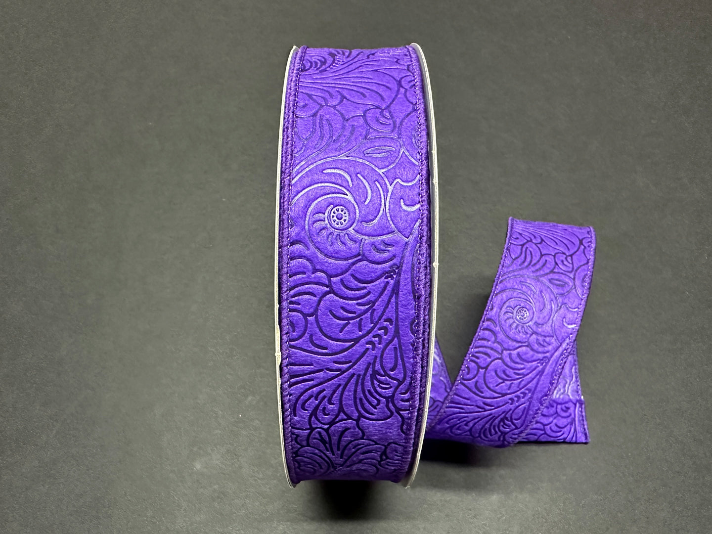 a pair of purple leather bracelets on a table