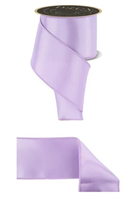 a purple ribbon with a black label.