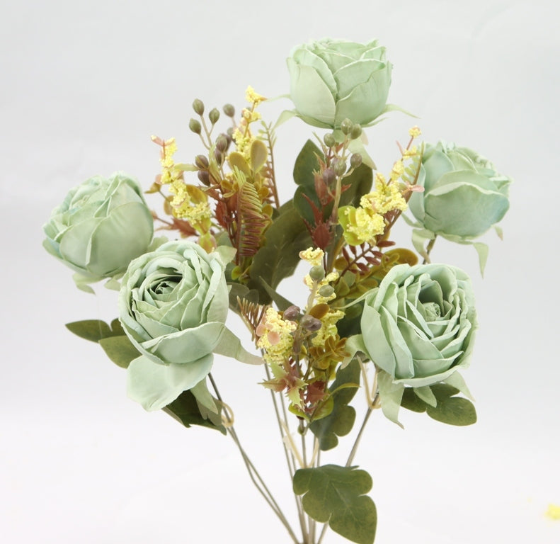 a vase filled with flowers on top of a table