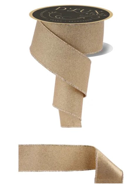a gold-colored ribbon with a black label, and a smaller piece of the same ribbon.