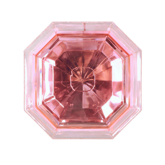 a close up of a pink diamond on a white background