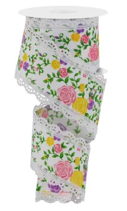 A floral patterned ribbon with a lace-like trim, featuring a mix of pink, yellow, and purple flowers.