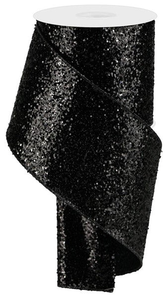 A roll of black sequin ribbon with a white top.