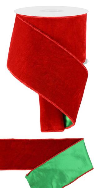 a roll of red velvet ribbon with a green ribbon