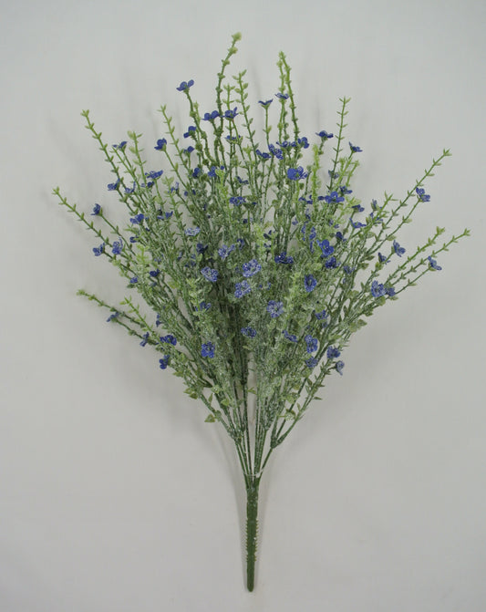 A bouquet of small blue flowers with green stems is displayed against a plain white background.