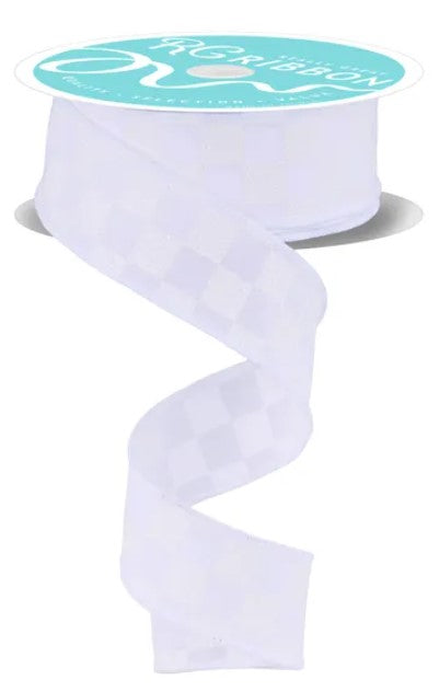 A roll of white ribbon with a checkered pattern on it.