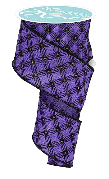 a purple fabric with a black and gold geometric pattern.