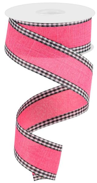 a pink ribbon with black and white checks on it