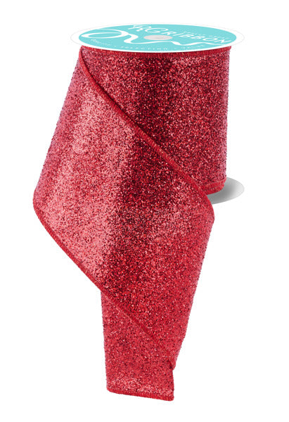 a roll of red glitter ribbon on a white background