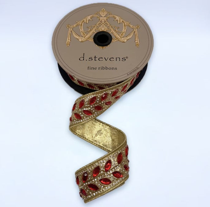 A roll of decorative ribbon with a gold and red floral pattern, featuring a gold and red floral design on the top of the ribbon.