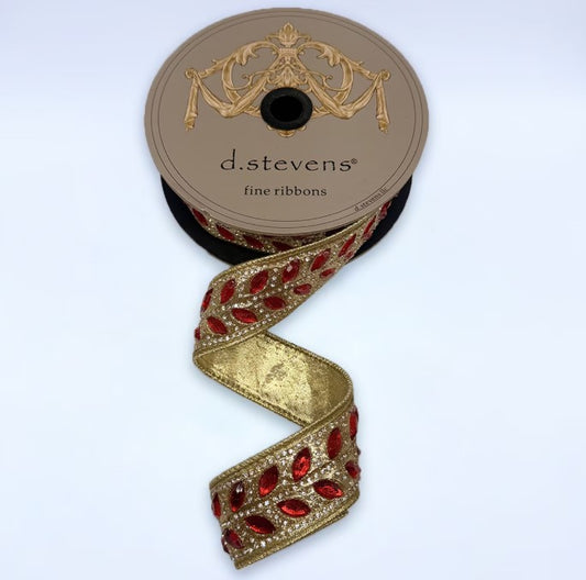 A roll of decorative ribbon with a gold and red floral pattern, featuring a gold and red floral design on the top of the ribbon.