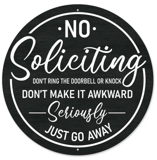a sign with a black and white design that reads "No Solicitation Don't ring the doorbell or knock Don't make it awkward seriously just go away".