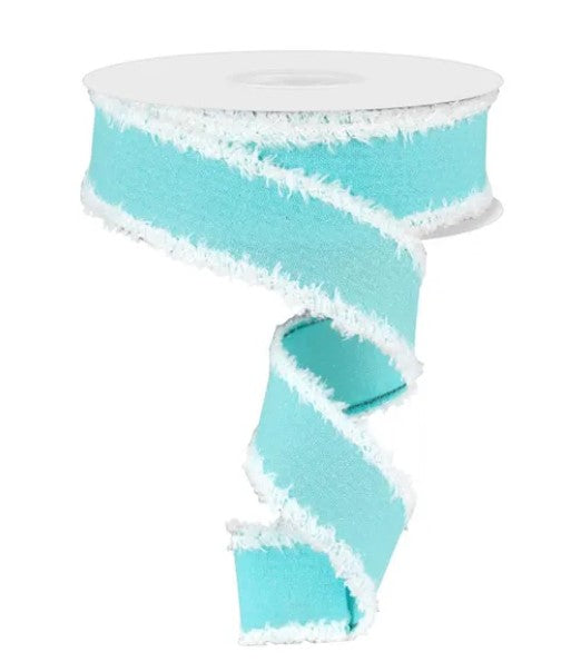 A turquoise-colored ribbon with white fringe, which appears to be a decorative or festive item.