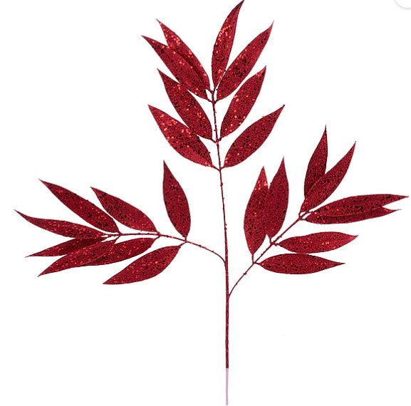 a branch with red leaves, which appear to be fake and made of glitter.
