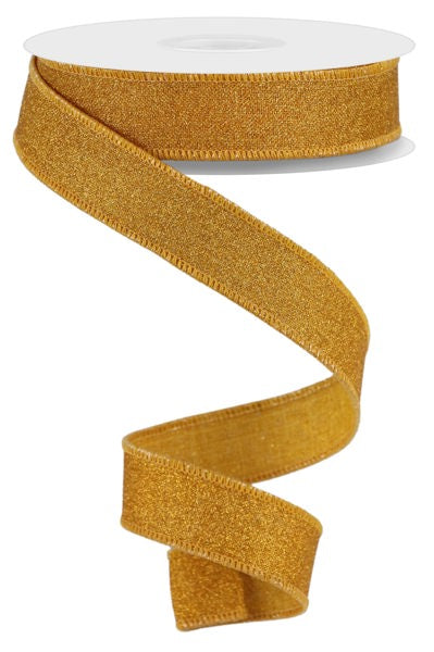 a roll of gold glitter ribbon on a white background