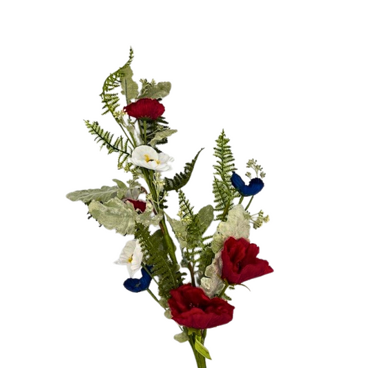a vase filled with red, white and blue flowers
