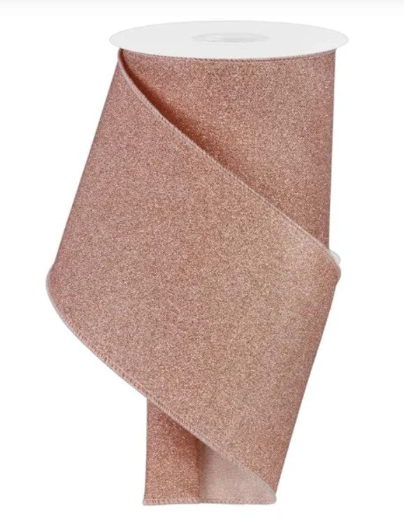 A roll of pink glittery ribbon.