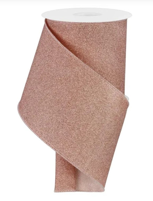 A roll of pink glittery ribbon.