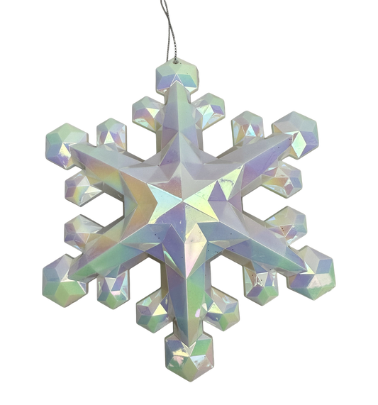 A decorative snowflake ornament made of small, iridescent crystals or stones, hanging against a gray background.