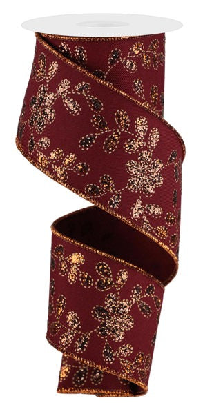 A burgundy and gold floral patterned ribbon is shown, with the ribbon winding around itself in a spiral pattern.