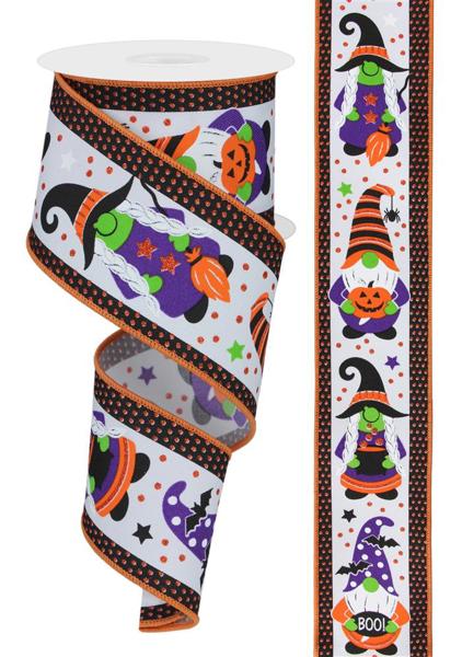 a roll of halloween ribbon with witches and pumpkins on it