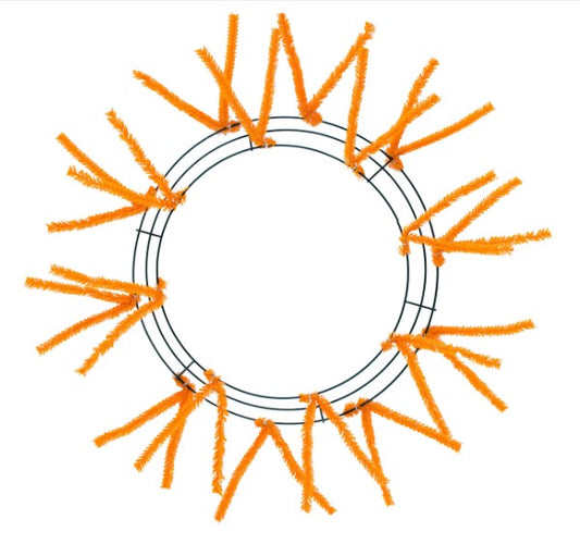 a circular wreath made of orange pipe cleaners arranged in a circular pattern.