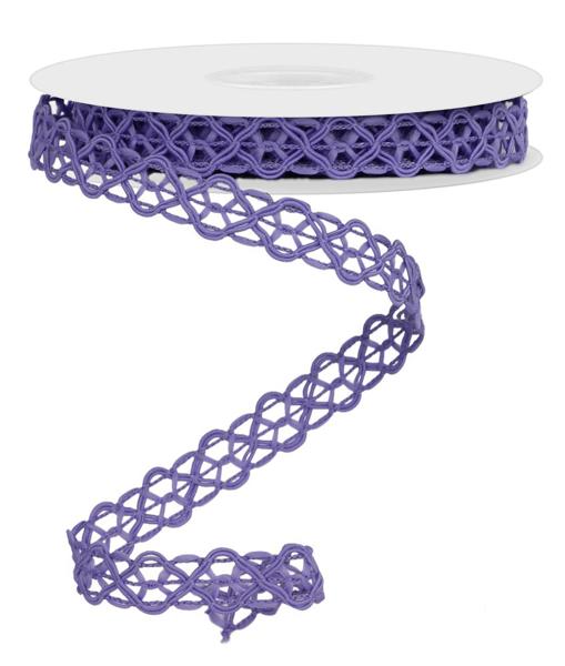 a spool of purple ribbon on a white background