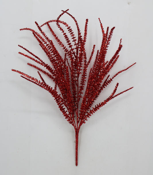 A single red, glittery branch with numerous small, thin, and delicate leaves or flowers.
