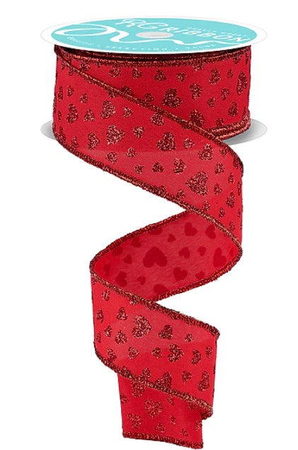 a red ribbon with a pattern of red hearts on it.