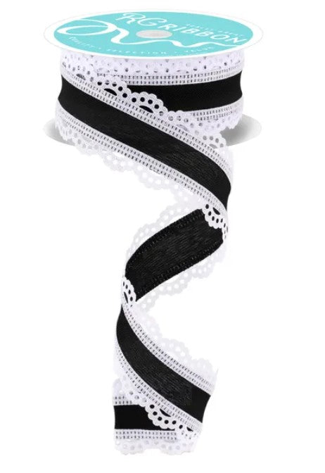 A spool of black and white lace ribbon with a white lace trim.