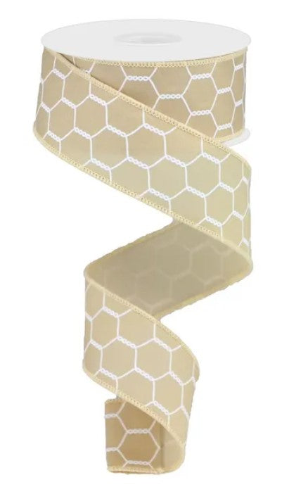 A roll of beige and white hexagonal patterned ribbon.