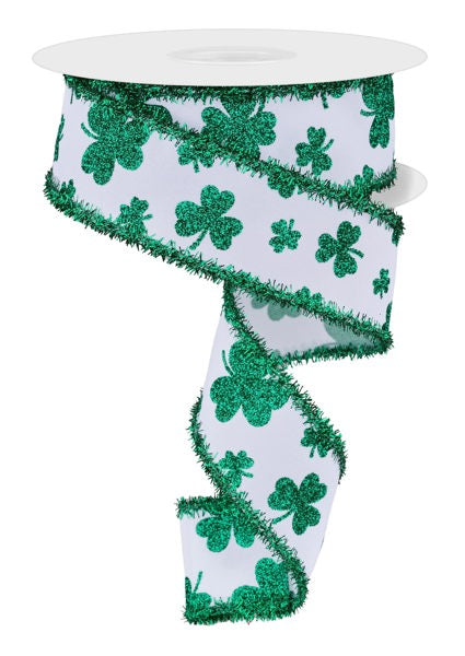 a white and green ribbon with shamrocks on it