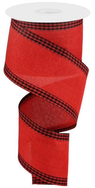 a roll of red and black plaid ribbon