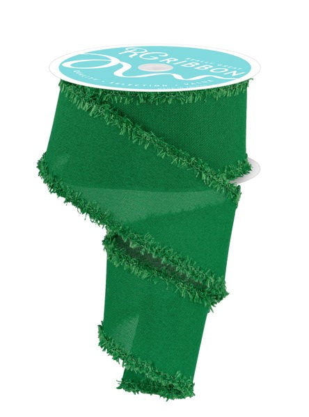 A roll of green, fringed ribbon with a white label that reads "Ribbon".
