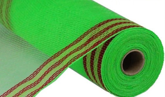A roll of green and red fabric with a patterned design.