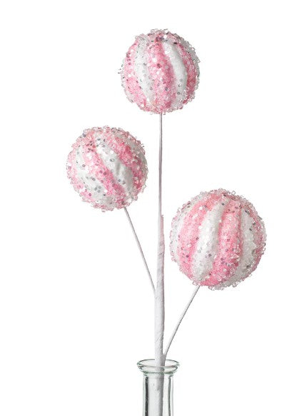 three pink and white lollipops in a vase