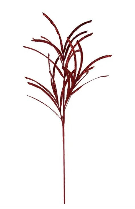 A red, metallic, leaf-like object with a thin, elongated stem.