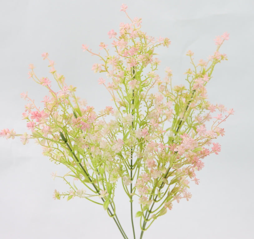 A bouquet of delicate pink flowers with green stems, creating a beautiful and natural arrangement.