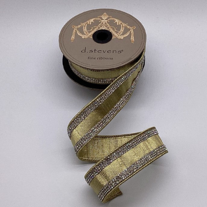 A spool of gold and silver ribbon with rhinestones, labeled as a fine ribbon from D. Stevens.