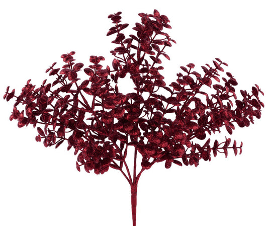 A branch with red leaves and flowers against a white background.
