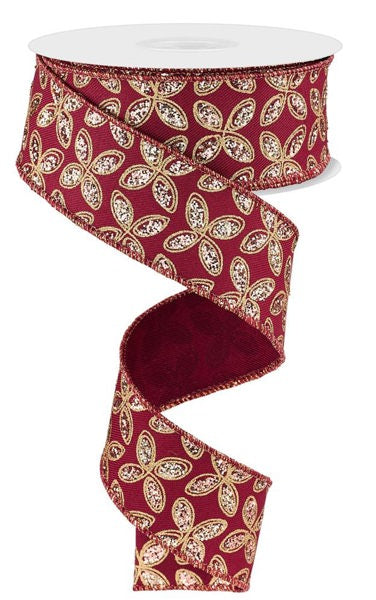 a red and gold floral patterned ribbon.