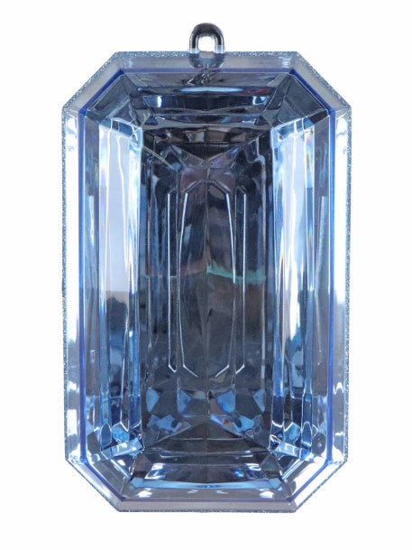 a large, clear, blue diamond-like crystal or gemstone.